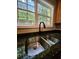 Close-up of a modern kitchen sink with a sleek faucet and granite countertops at 2612 Haligan Pt, Riverdale, GA 30296
