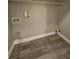 Empty laundry room featuring stylish flooring, a shelving unit, and convenient connections at 2612 Haligan Pt, Riverdale, GA 30296
