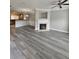 Spacious living room featuring a fireplace, open floor plan, and stylish flooring at 2612 Haligan Pt, Riverdale, GA 30296
