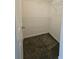A walk-in closet with carpet flooring and wire shelving for optimal storage solutions at 2612 Haligan Pt, Riverdale, GA 30296