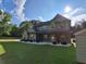 Attractive two-story home featuring a covered front porch and well-maintained lawn in a sunny setting at 2647 Old Snapping Shoals Rd, Mcdonough, GA 30252