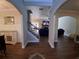 Open-concept foyer featuring hardwood floors and arched doorways leading to the living areas at 2647 Old Snapping Shoals Rd, Mcdonough, GA 30252