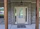 Welcoming front entrance featuring a glass-paneled door, sidelights, and a decorative welcome mat at 2647 Old Snapping Shoals Rd, Mcdonough, GA 30252