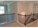 Second story hallway with wooden and black rod railing at 2647 Old Snapping Shoals Rd, Mcdonough, GA 30252