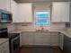 Stylish kitchen featuring stainless steel appliances, granite counters, and white subway tile at 2647 Old Snapping Shoals Rd, Mcdonough, GA 30252