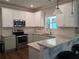 Beautiful kitchen with granite countertops, stainless steel appliances, and a breakfast bar at 2647 Old Snapping Shoals Rd, Mcdonough, GA 30252