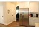 Well-equipped kitchen with stainless steel refrigerator and ample cabinet space at 2647 Old Snapping Shoals Rd, Mcdonough, GA 30252