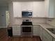 Updated kitchen featuring granite counters, stainless steel appliances and subway tile backsplash at 2647 Old Snapping Shoals Rd, Mcdonough, GA 30252