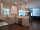 Modern kitchen featuring granite countertops, white cabinets, and stainless steel appliances at 2647 Old Snapping Shoals Rd, Mcdonough, GA 30252