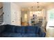 Living room showcases open floor plan with sight lines to kitchen and backyard at 2647 Old Snapping Shoals Rd, Mcdonough, GA 30252