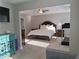 Spacious main bedroom with a ceiling fan and neutral carpet, framed by doorway view at 2647 Old Snapping Shoals Rd, Mcdonough, GA 30252