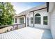 Beautiful back deck area with white siding and large windows at 7037 Tara Dr, Villa Rica, GA 30180