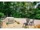 Patio area features a generator and seating area on the rock ground at 7037 Tara Dr, Villa Rica, GA 30180