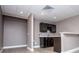 Finished basement featuring light wood-look flooring, recessed lighting, and a modern wet bar area with wine rack at 7037 Tara Dr, Villa Rica, GA 30180