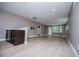 Finished basement featuring light wood-look flooring, recessed lighting, and a wet bar area with dark cabinets at 7037 Tara Dr, Villa Rica, GA 30180