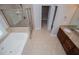 Beautiful bathroom with garden tub and glass shower enclosure at 7037 Tara Dr, Villa Rica, GA 30180