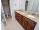 Bathroom with tile floors, double vanity, and granite countertops at 7037 Tara Dr, Villa Rica, GA 30180