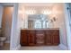 Primary bathroom with double vanity sinks and a large mirror at 7037 Tara Dr, Villa Rica, GA 30180