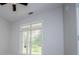 Bright bedroom with ceiling fan and large window at 7037 Tara Dr, Villa Rica, GA 30180