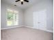 Spacious bedroom with large window, neutral carpet and double closet at 7037 Tara Dr, Villa Rica, GA 30180