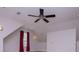 Bright, carpeted bonus room with dormers and ceiling fan at 7037 Tara Dr, Villa Rica, GA 30180