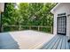 Large deck with wooded views is perfect for enjoying the outdoors and a relaxing setting at 7037 Tara Dr, Villa Rica, GA 30180