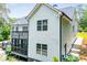 View of the home's exterior featuring multiple decks and lush landscaping at 7037 Tara Dr, Villa Rica, GA 30180