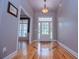 Inviting foyer featuring gorgeous hard wood floors, natural light, and neutral colors at 7037 Tara Dr, Villa Rica, GA 30180