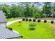 Well manicured front yard with a long driveway and mature trees at 7037 Tara Dr, Villa Rica, GA 30180