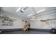 Spacious garage with storage racks and stairs to an upper level at 7037 Tara Dr, Villa Rica, GA 30180