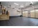 Large garage featuring epoxy floors, shelving, and two garage doors at 7037 Tara Dr, Villa Rica, GA 30180