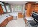 Stylish kitchen with stainless steel appliances, white countertops, and beautiful wood cabinets at 7037 Tara Dr, Villa Rica, GA 30180