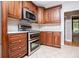Well-equipped kitchen featuring modern appliances, tile backsplash, and ample cabinet space at 7037 Tara Dr, Villa Rica, GA 30180