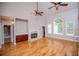 Inviting living room boasts hardwood floors, fireplace, built-ins, and large windows at 7037 Tara Dr, Villa Rica, GA 30180