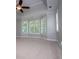 Bright main bedroom with large windows offering lots of natural light and spacious carpeting at 7037 Tara Dr, Villa Rica, GA 30180
