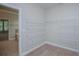 View of the walk-in closet with wire shelving and carpeted floor at 7037 Tara Dr, Villa Rica, GA 30180