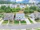 Aerial view of a well-manicured property in a suburban neighborhood with mature trees and green lawns at 226 Creek View Ln, Acworth, GA 30102