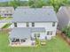 View of the home's backyard featuring a covered patio area, green grass, and a privacy fence at 226 Creek View Ln, Acworth, GA 30102