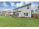 Spacious backyard with green grass, a covered patio, and a fence, providing plenty of room for outdoor enjoyment at 226 Creek View Ln, Acworth, GA 30102