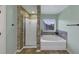 Bathroom showcasing a separate shower and tub, accented with stylish tile work at 226 Creek View Ln, Acworth, GA 30102