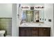Bright bathroom featuring a double vanity with marble countertop and a tiled walk-in shower at 226 Creek View Ln, Acworth, GA 30102