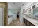 The primary bathroom features a double vanity and a relaxing soaking tub at 226 Creek View Ln, Acworth, GA 30102