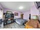 Cozy bedroom with a television, closet, and dresser at 226 Creek View Ln, Acworth, GA 30102