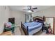 Cozy bedroom with a comfortable bed, ceiling fan, and natural light at 226 Creek View Ln, Acworth, GA 30102