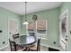 Cozy breakfast nook with table, chairs and natural light at 226 Creek View Ln, Acworth, GA 30102