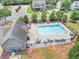 Aerial view of the community pool featuring lounge chairs, umbrellas, and a pool house at 226 Creek View Ln, Acworth, GA 30102