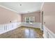Bright dining room with wainscoting, tile floors, and a view from the double windows at 226 Creek View Ln, Acworth, GA 30102