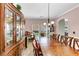 Spacious dining area featuring a large china cabinet and long table at 226 Creek View Ln, Acworth, GA 30102