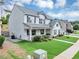 Side view of a well-maintained two-story house with a lush green lawn and manicured landscaping at 226 Creek View Ln, Acworth, GA 30102