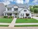 Charming two-story home with a well-manicured lawn, covered porch, and lovely landscaping at 226 Creek View Ln, Acworth, GA 30102